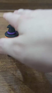 Video showing Halloween pumpkin fidget keychain with light and sound effects