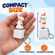 Compact portable unicorn fidget keychain shown in hand