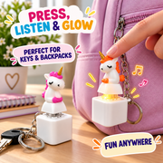 Pressing rechargeable unicorn fidget keychain to activate colorful light and sound